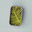 Rectangular tray with yellow and black leaf pattern on a purple border against a light gray background