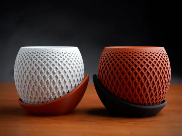Modern polygon planter nested in its sculptural plate